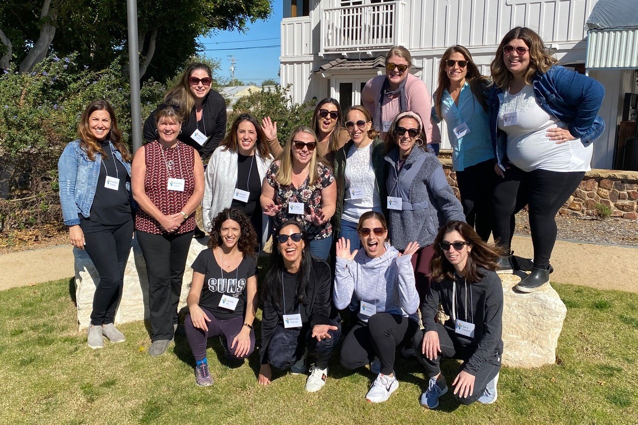 Cohort 2 of the Pauline Foster Women's Leadership Institute together outdoors during a program day